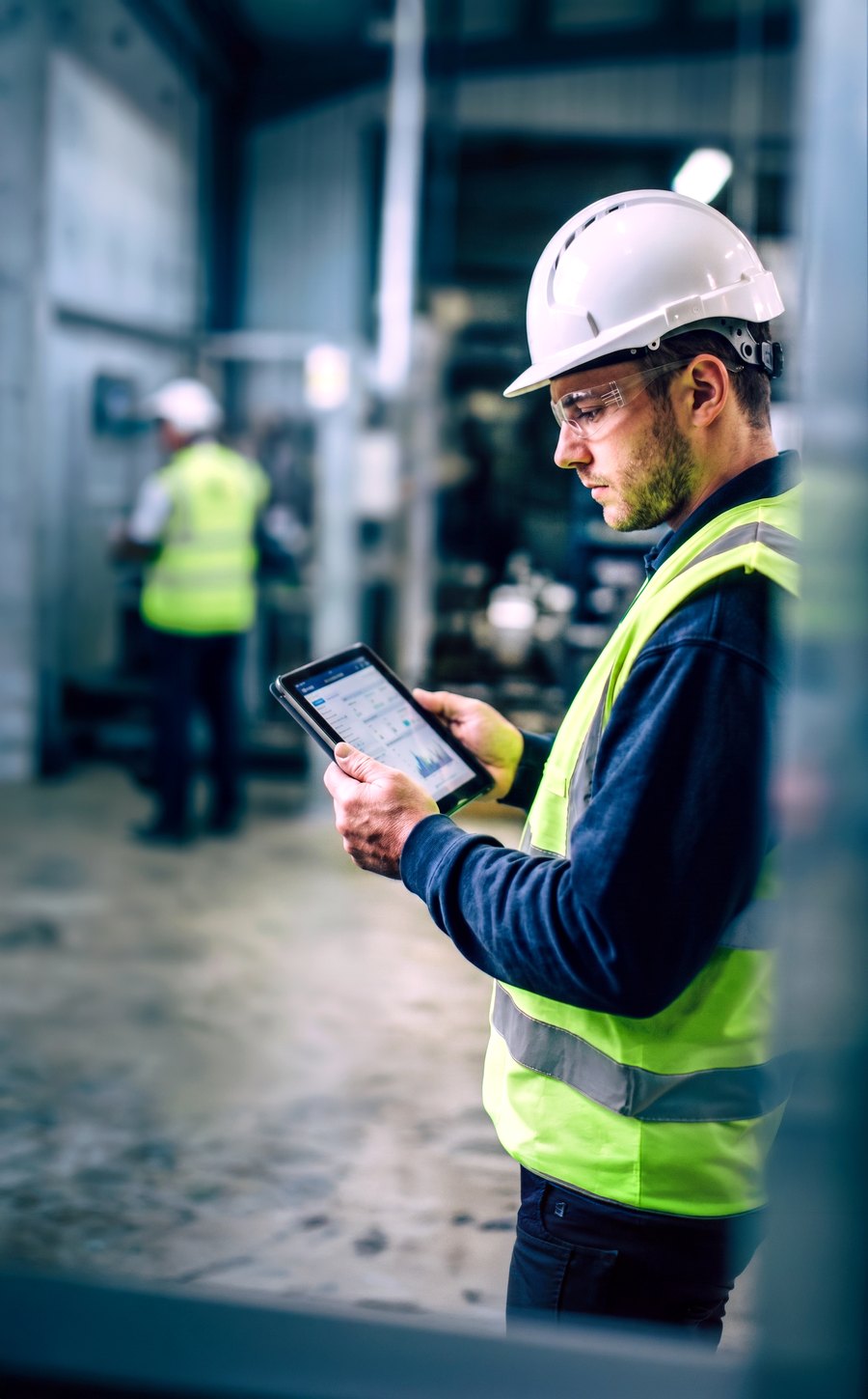Logistics operative reviewing data on a tablet